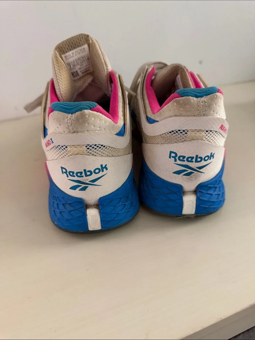 Reebok nano x White Athletic Sneakers with Pink & Blue Highlights